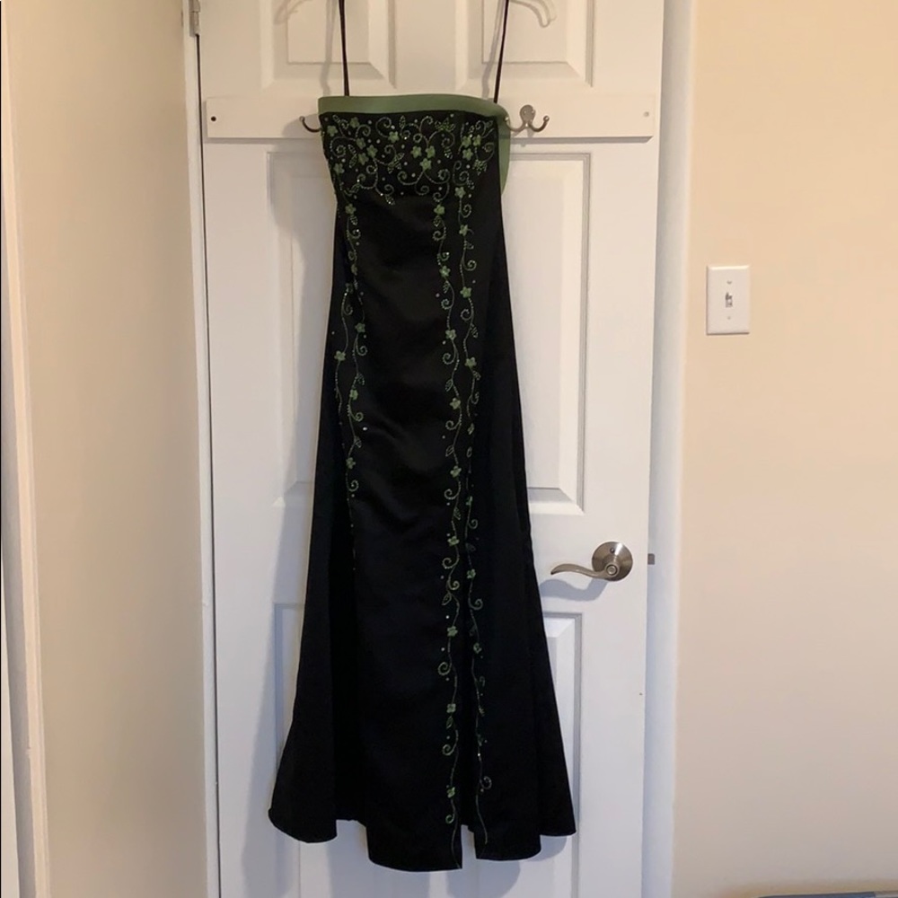 Black prom dress with green appliqués
